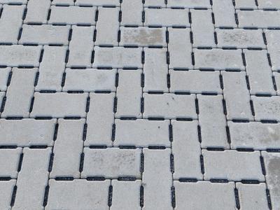 Waterpasserende klinkers met kift tussen KMO-zone GLK
